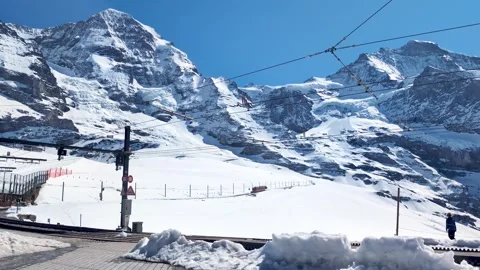 Mountain train on Kleine Scheidegg alpine mountain pass with Eiger and Monch. Stock Footage 340351358