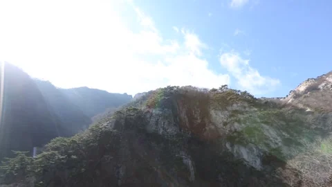 Mountain with trees and blue sky 스톡 동영상 303391838