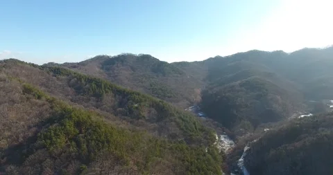 Mountain with trees and blue sky 動画素材 303550849