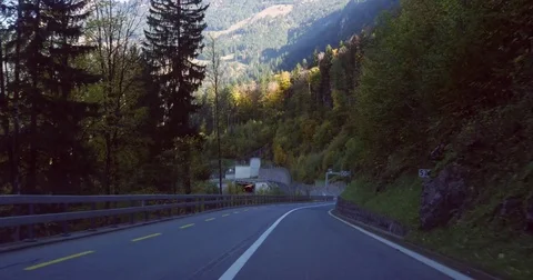 Mountain tunnel, Cinema 4k view driving on a alpine road, in a tunnel, on a s Stock Footage 83105331
