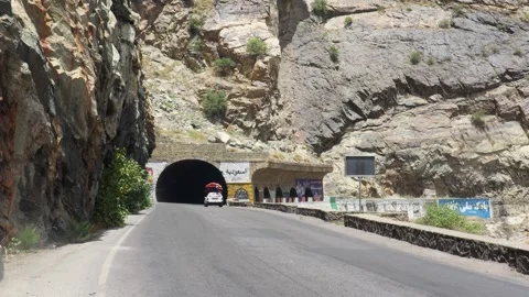 Mountain Tunnel Cutting Through Mahipar Peak from Above Stock Footage 327433255