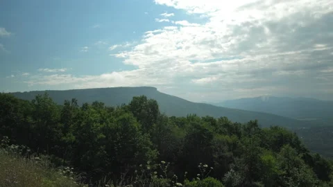 Mountain under blue sky with clouds on summer vacation in the morning Stock Footage 233957372