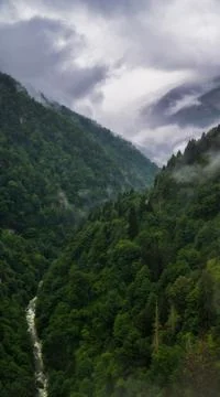 Mountain under clouds Stock Photos