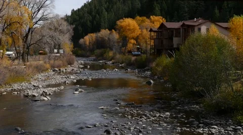 Mountain vacation lodge on River's edge, 4K Stock Footage 56440002