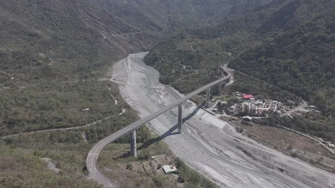 Mountain Valley Bridge: Connecting Remote, Rugged Landscapes Stock Footage 331571437
