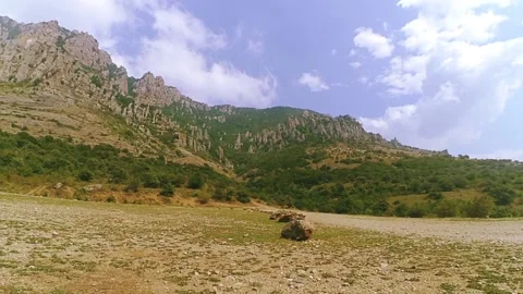 Mountain valley clouds over the rocks are floating 스톡 동영상 89146994