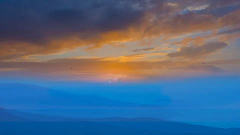 Mountain valley in dense mist at the early morning 스톡 동영상 241501006
