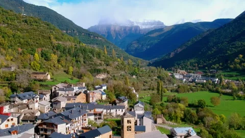 Mountain Valley with Distant View of Broto Village, Spain Stock Footage 315279705