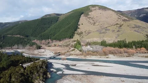 Mountain Valley with Dry Riverbed and Rugged Terrain Stockbeeldmateriaal 337472237