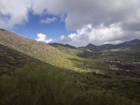 Mountain valley landscape with dramatic cloudy sky Stock Photos