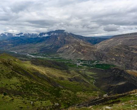Mountain Valley Landscape Under Cloudy Skies Stock Photos