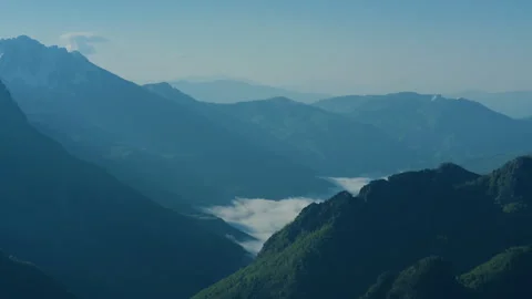 Mountain valley with low clouds landscape static top view Stock Footage 337011363