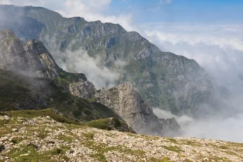 Mountain valley in the mist Stock Photos