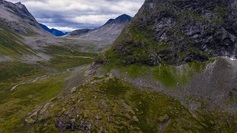 Mountain valley with moss-covered slopes and stream, Rauma region Norway Foto stock