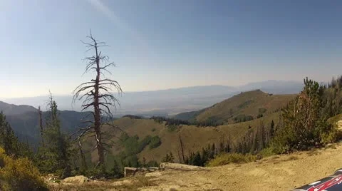 Mountain valley overlook sitting in ATV HD 008 Stock Footage
