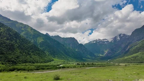 Mountain valley panorama with clouds shadows moving Vídeo Stock 347404694