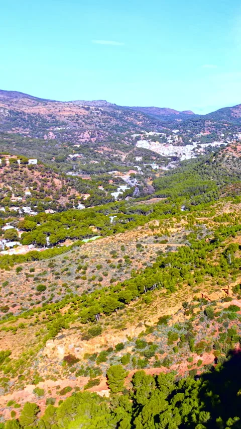 Mountain valley with pine forest and white village, Valencia, Spain Vertical Video stock 346841875