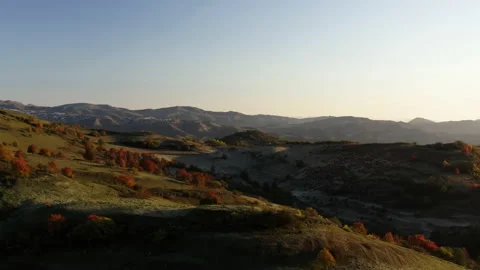 Mountain valley in the rays of the rising sun. Aerial cinematic 4k shot. Stock Footage 143836999