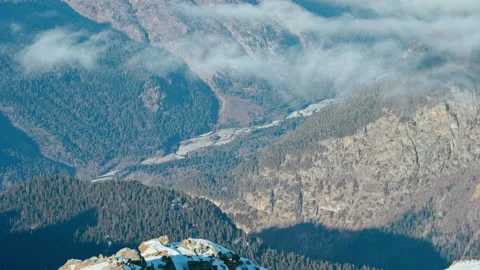 Mountain valley with a river in the clouds in sunny weather, Caucasus mountains Stock Footage 138035945