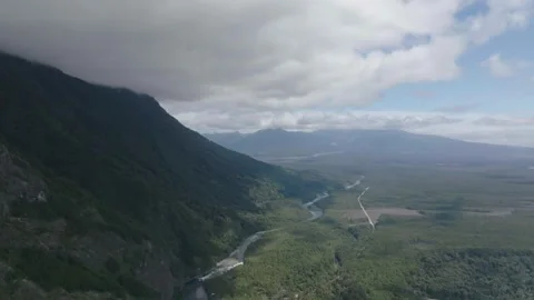 Mountain Valley with River Flowing to Blue Lake Stock Footage 310614161