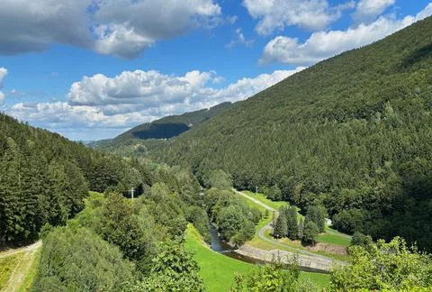 Mountain valley with river, forest and green landscape. Stock Photos