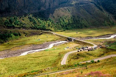 A mountain valley with a river running through it Stock Photos