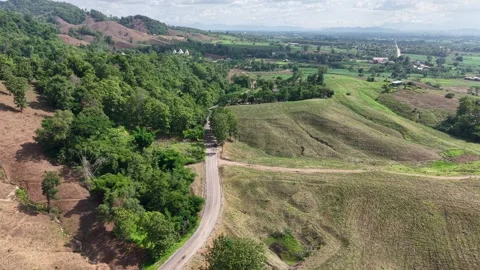 Mountain Valley Road Under Cloudy Skies – Pre-Rain Mood Stock Footage 310883090