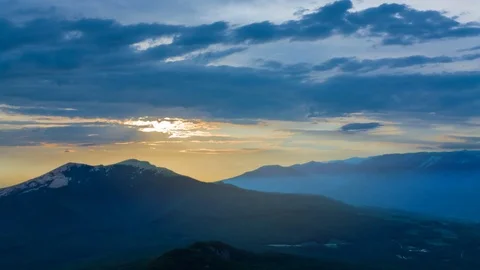 Mountain valley at the sunset in a blue mist time lapse scene Stock Footage 102220911