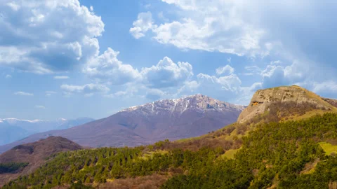 Mountain valley under blue sky Video stock 313280376