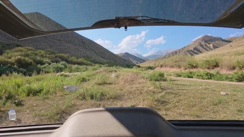 Mountain valley view from an open car trunk, Issyk-Kul Region, Kyrgyzstan Stock Footage 347242648