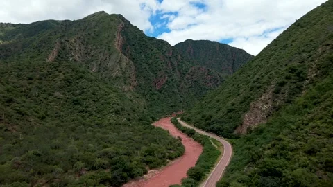 Mountain valley with winding road and river, Argentina Stock Footage 332284066