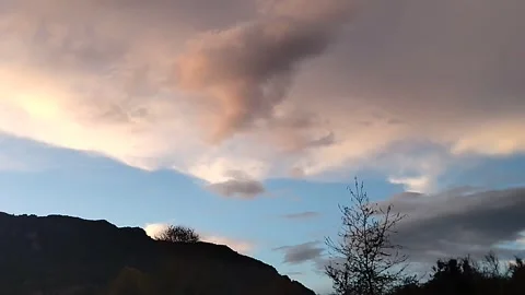 Mountain view after sunset. Scarlet sunset in the mountains. Bright sky. Vídeos de archivo 306569497