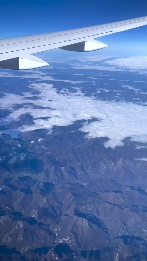 Mountain View from Airplane Window Stock Footage 308220706