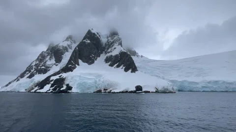 Mountain view in Antartica with reflection in water Stock Footage 240334115
