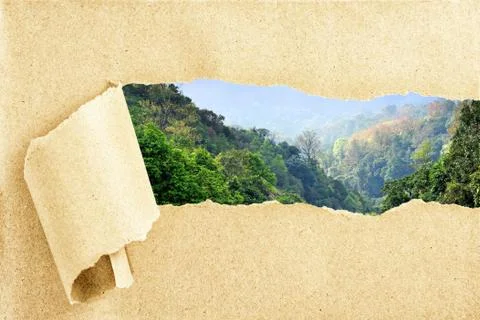 Mountain view behind torn recycled paper Stock Photos