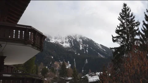 Mountain view with clouds moving from a chalet balcony timelapse Stock Footage 328401542
