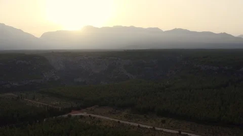 Mountain View with Drone moving towards the sun Stock Footage 114517504