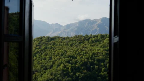 Mountain View Framed by Open Window Overlooking Forested Hills Stock Footage 333977715
