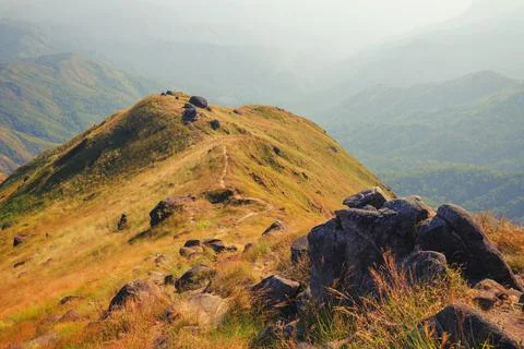 A mountain view full of grass In the evening Stock Photos