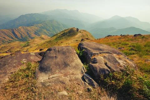 A mountain view full of grass In the evening Photos
