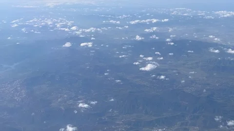 Mountain View High Altitude View From a Passenger Plane Stock Footage 277321733