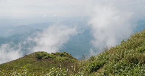 Mountain View of moving white clouds and fog blowing in the wind with sky. Stock Footage 149042721
