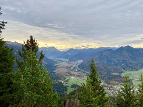 Mountain view over valley with clouds during sunset, alps, Bavaria, Germany Stock Photos