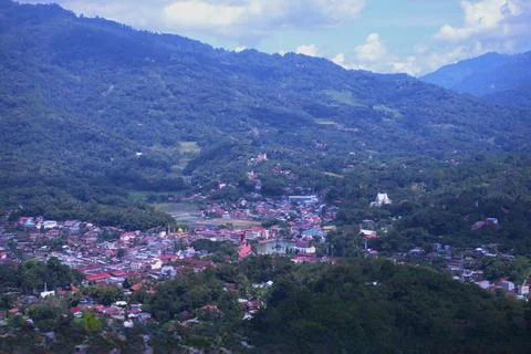 A mountain view with a small town below Stock Photos