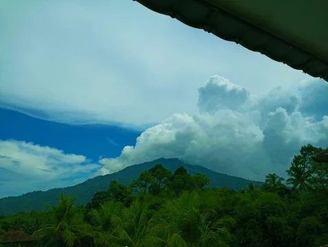Mountain view with thick white clouds Stock Photos