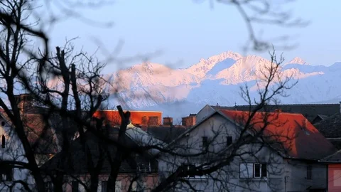  Mountain view through roofs Stock Footage 76442039