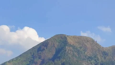 Mountain view with timelapse of white clouds in the background Stock Footage 252510981