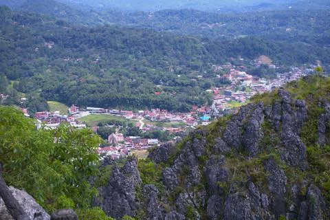 A mountain view with a town below Stock Photos
