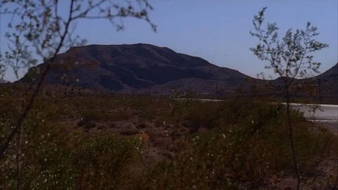 Mountain View with Van Approching Desert Road Video stock 82593189