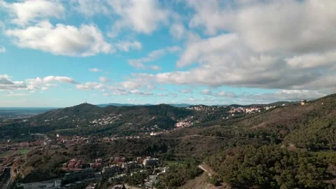 Mountain view with walking paths next to a beautiful city Stock Footage 166834082